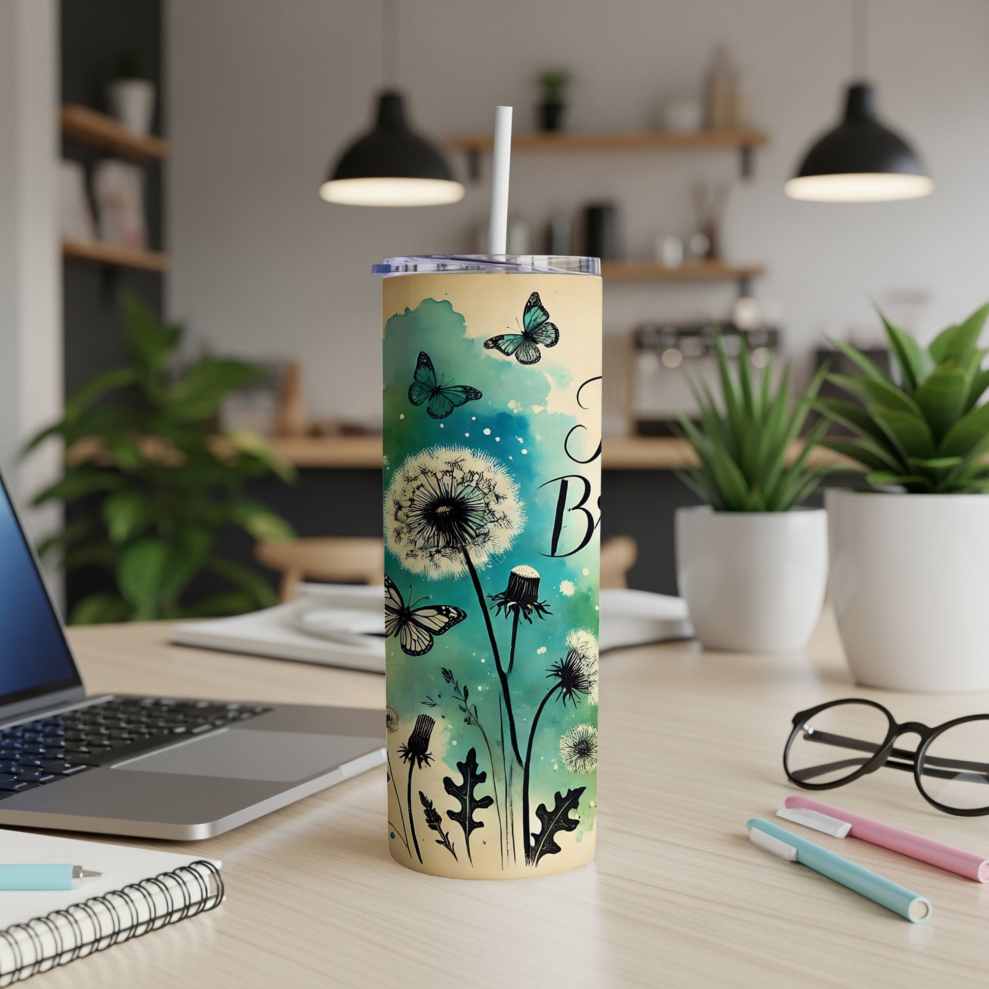 Yellow tumbler with dandelions and butterflies, "Be Kind" text.