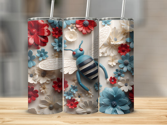 Bee and floral design on a white tumbler with red and blue accents.