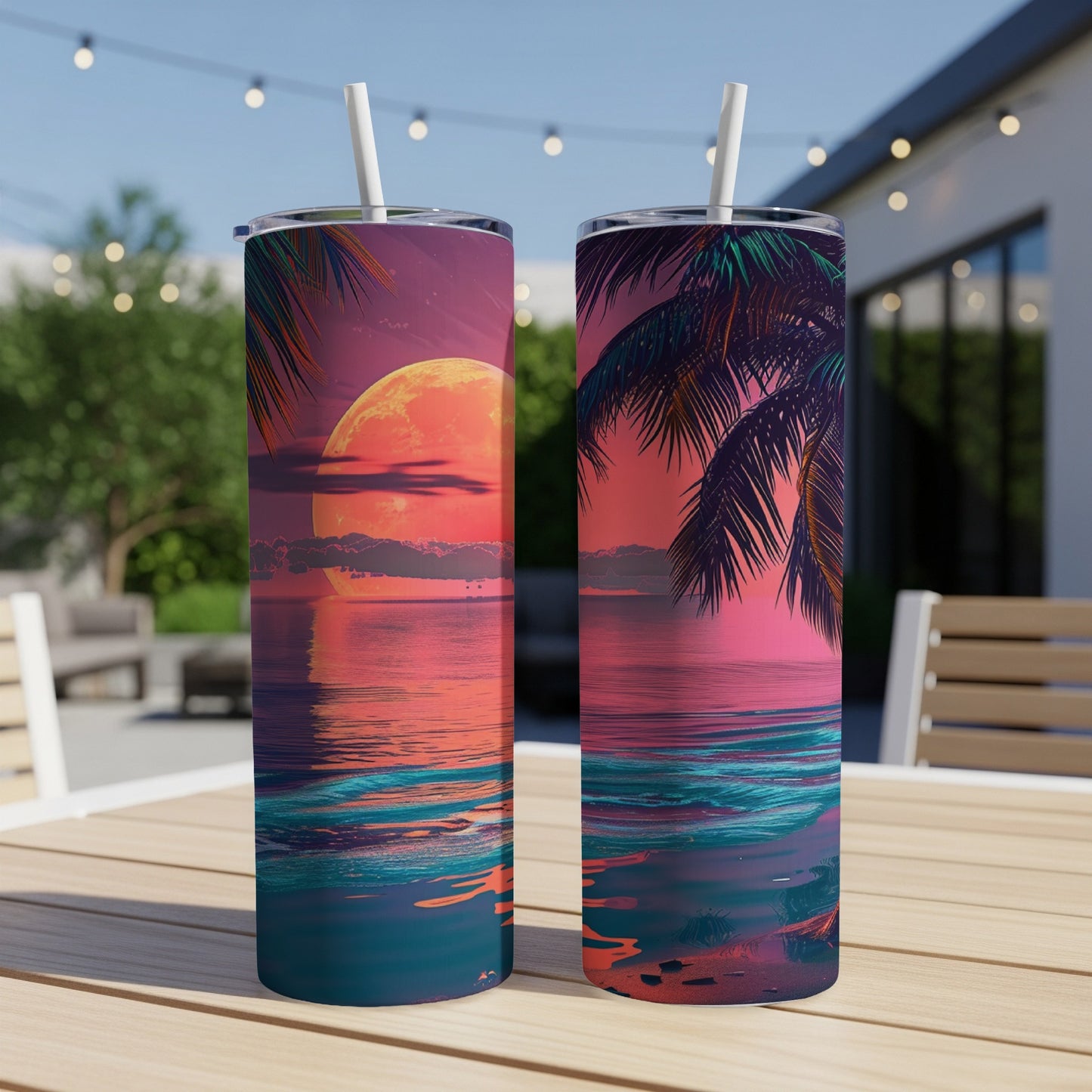 Two tumblers with a vibrant sunset and ocean scene.