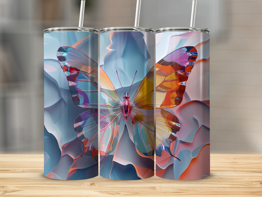 Three tumblers with iridescent butterfly wings, set on a wooden surface.