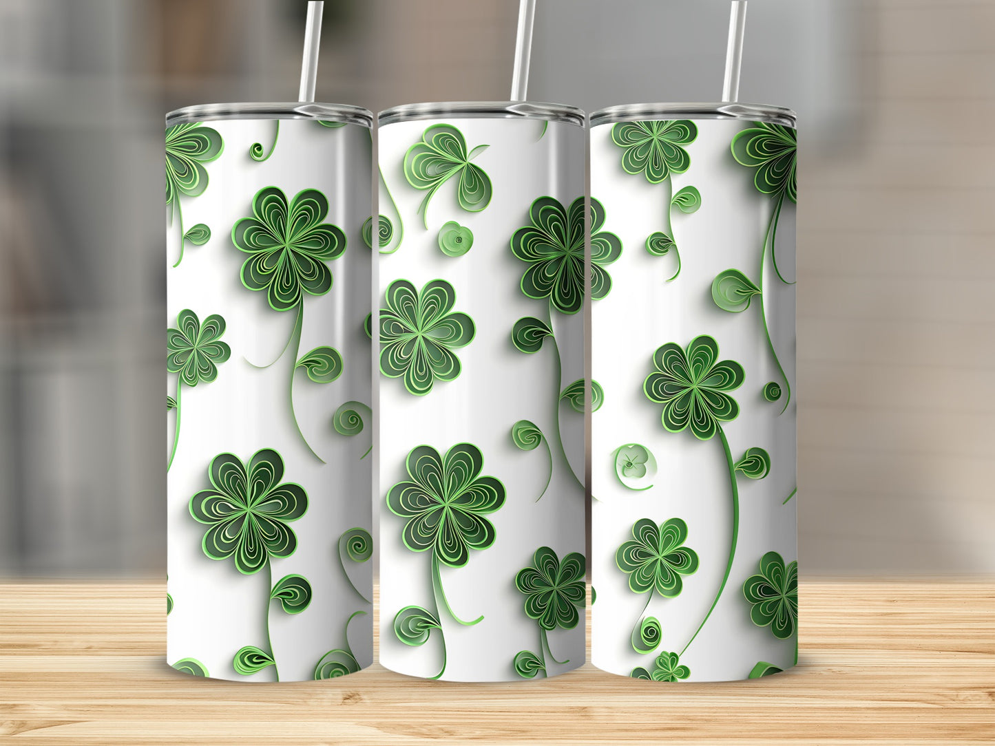 Three tumblers with a repeating green shamrock clover pattern on a white background.