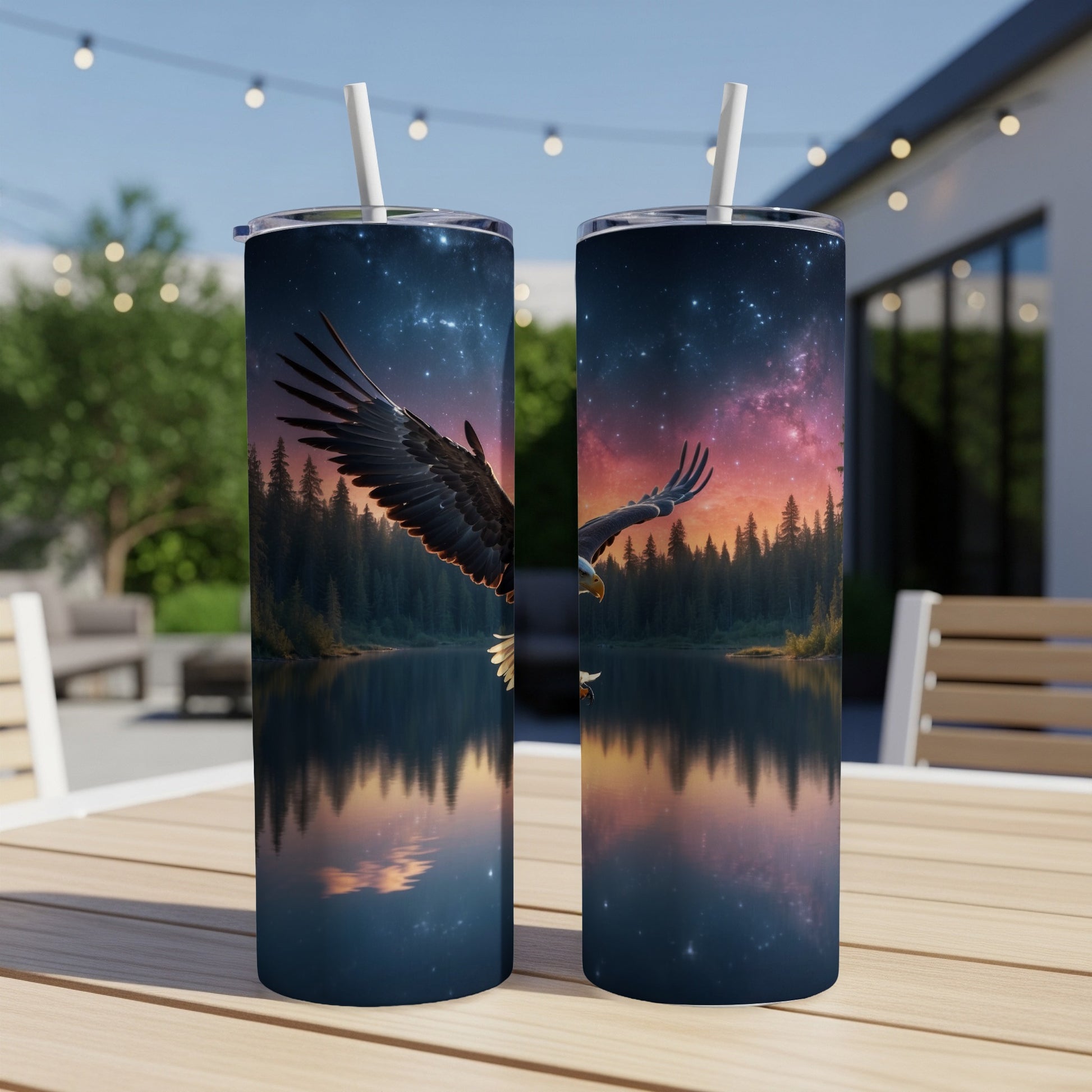 Two tumblers featuring an eagle in flight over a starry lake at sunset.