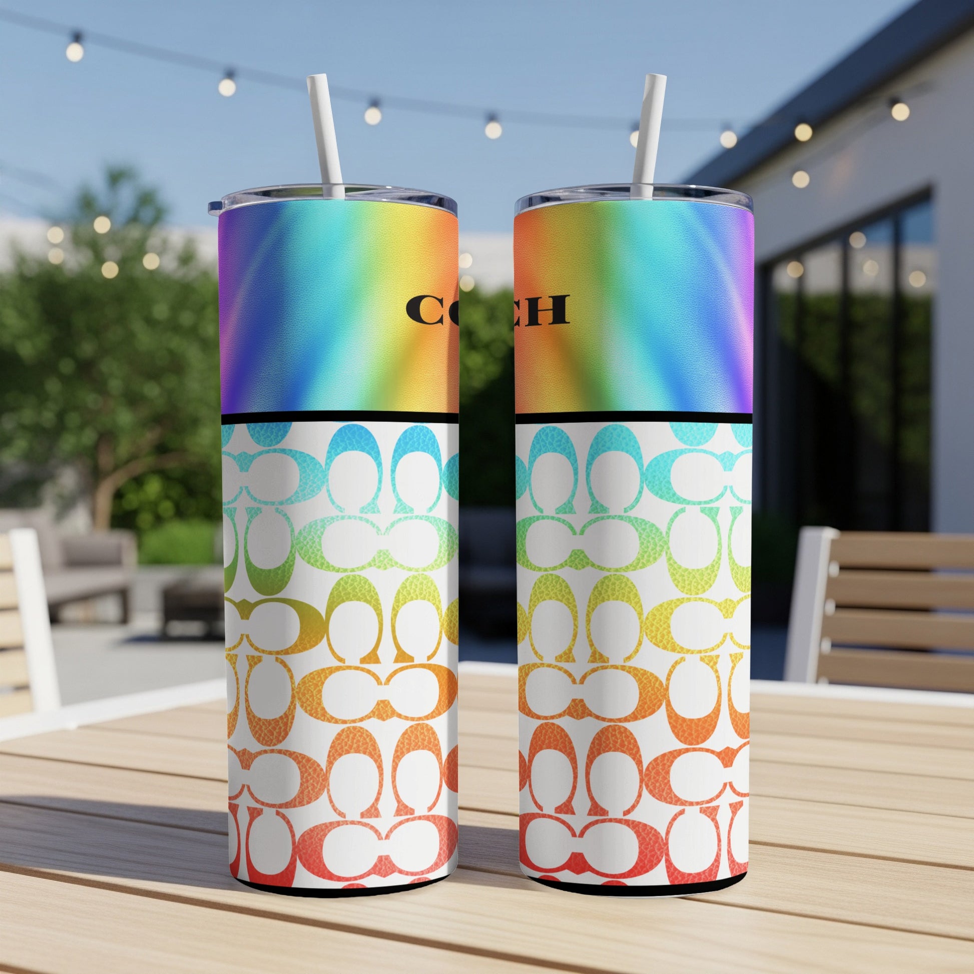 Two Coach tumblers with rainbow gradient and repeating C logo patterns.