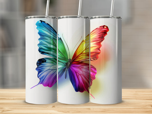 Three white tumblers with a rainbow butterfly design, two with straws.