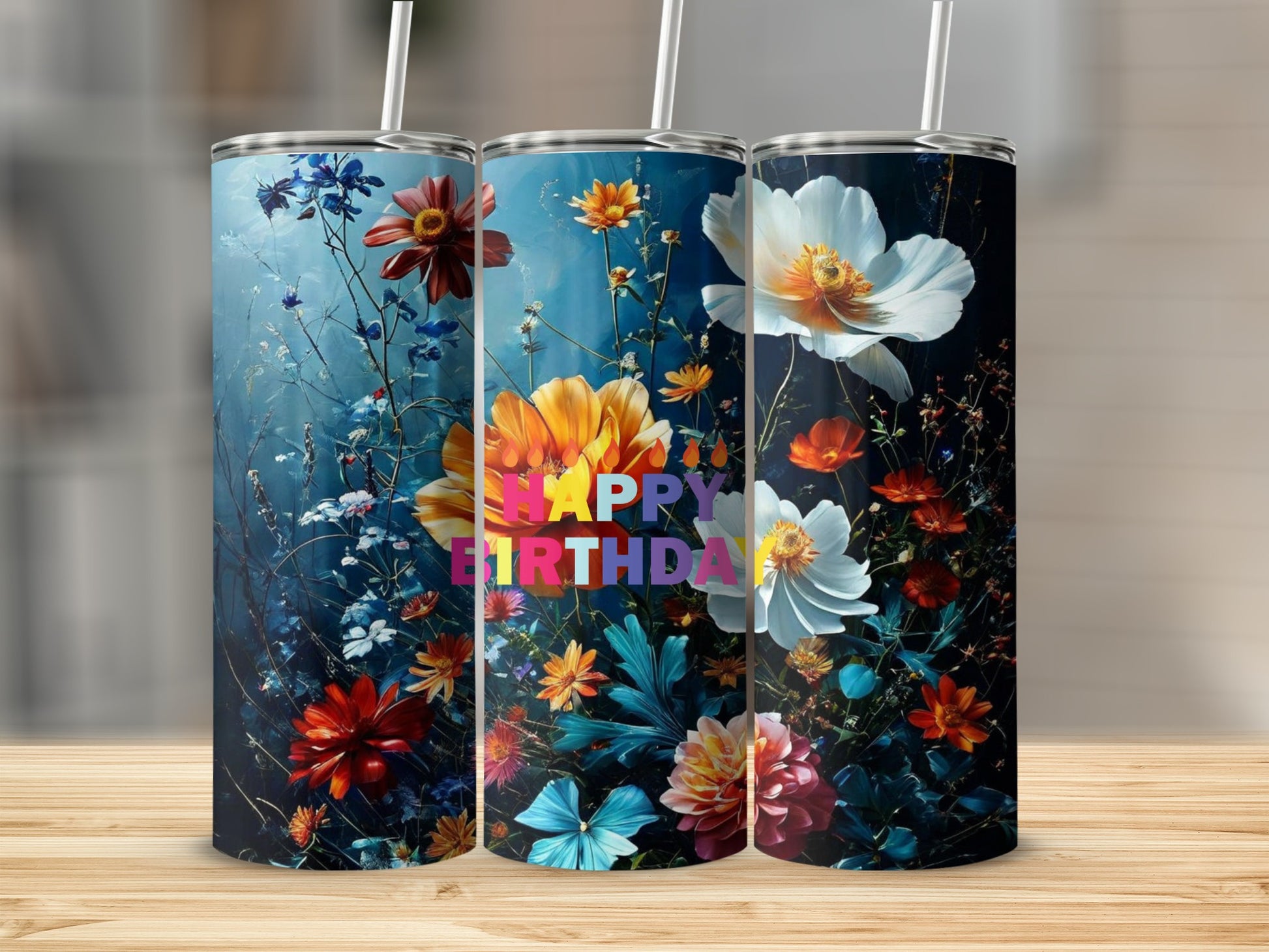 Tumblers with colorful flowers and "Happy Birthday" text on a dark background.