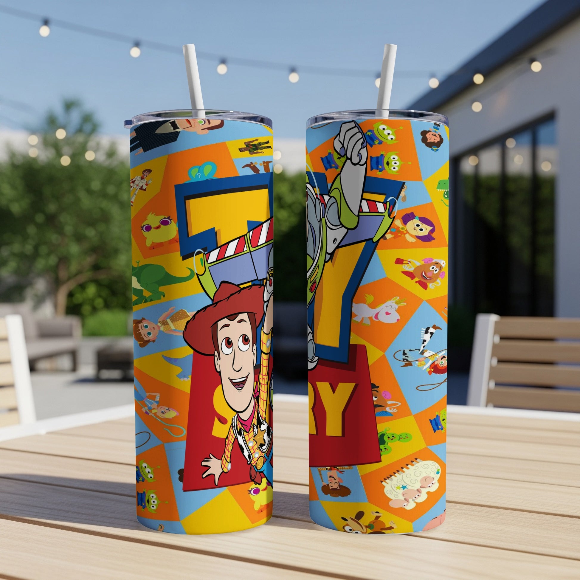 Toy Story characters on a blue and orange patterned tumbler with straws.