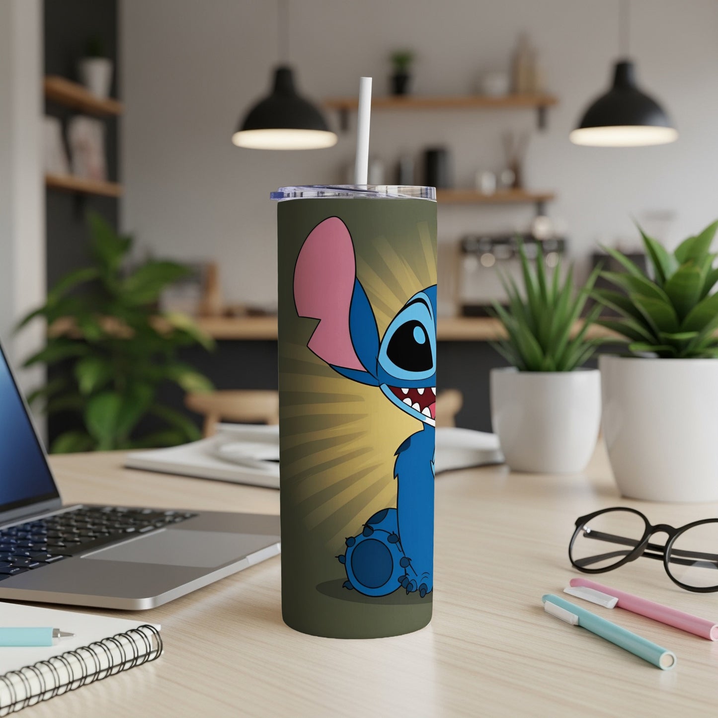 Blue Stitch character on a green tumbler with a straw.