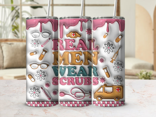 Pink and white tumbler with "Real Men Wear Scrubs" text and medical icons.
