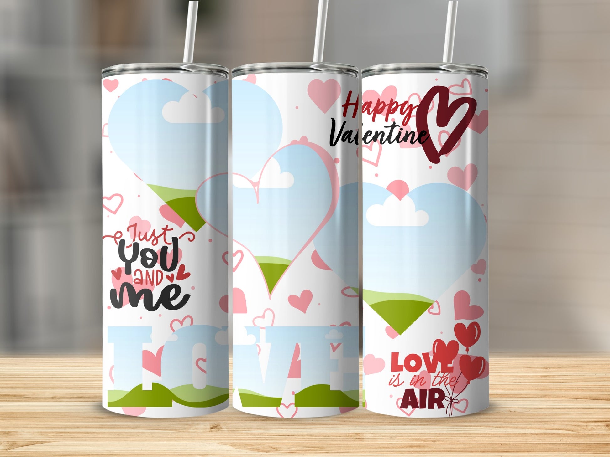 Three Valentine-themed tumblers with hearts, clouds, and text: "Just you and me," "Happy Valentine," and "Love is in the air."