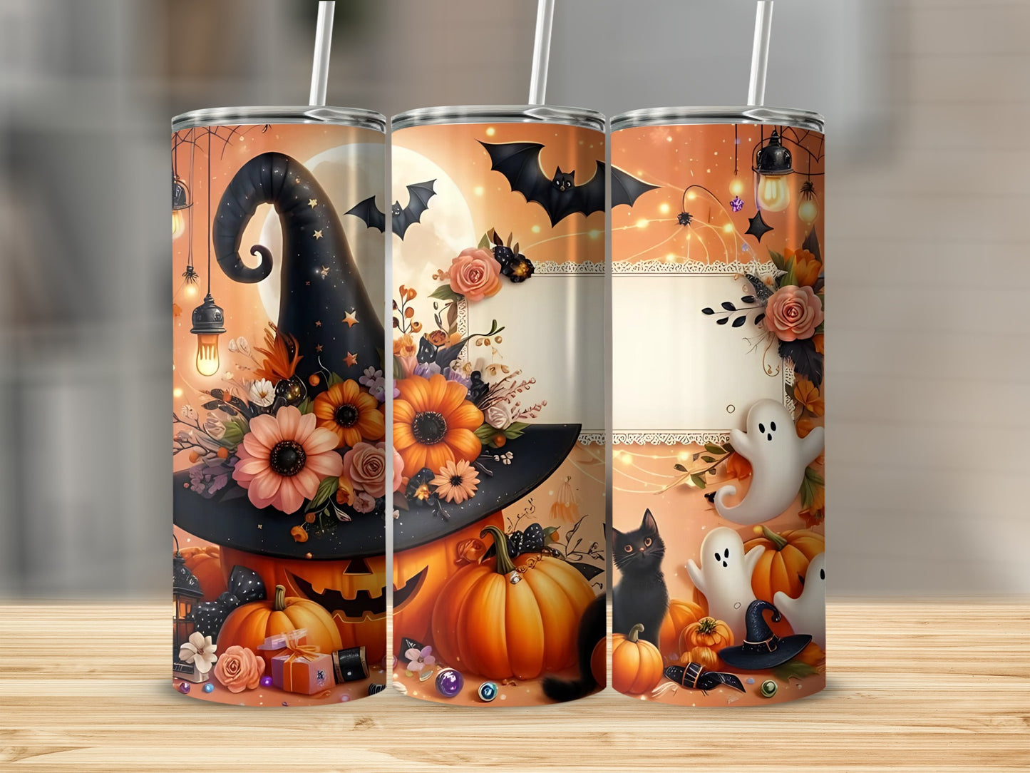 Three Halloween-themed tumblers with pumpkins, a witch hat, ghosts, a black cat, bats, and flowers.