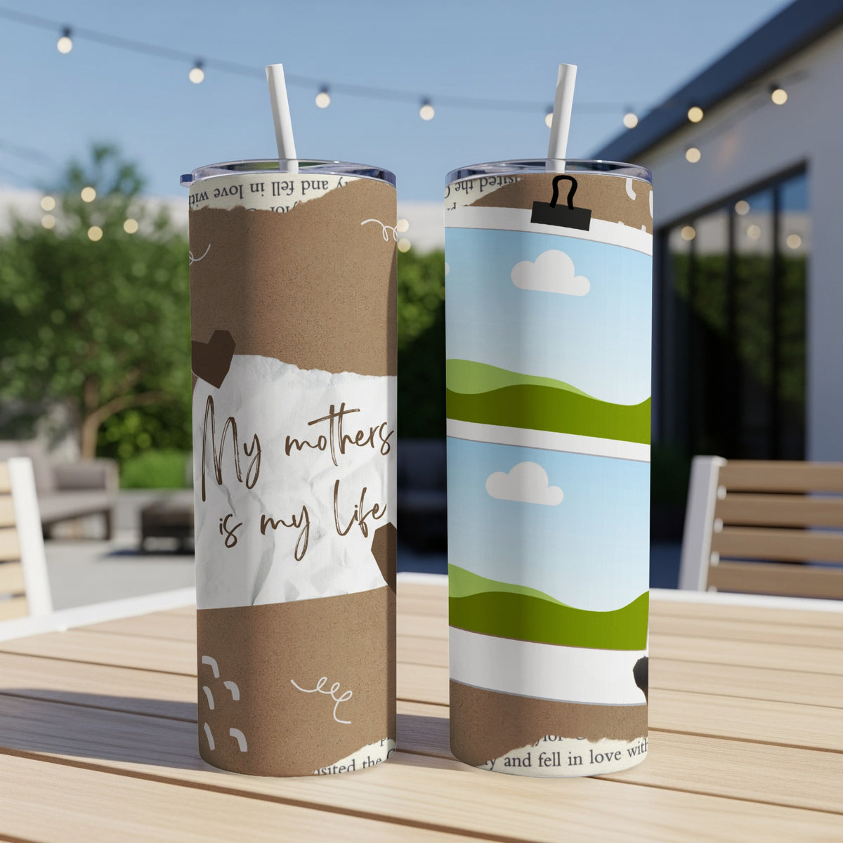 Two tumblers, one with "My mothers is my life" text, sit on a wooden table.