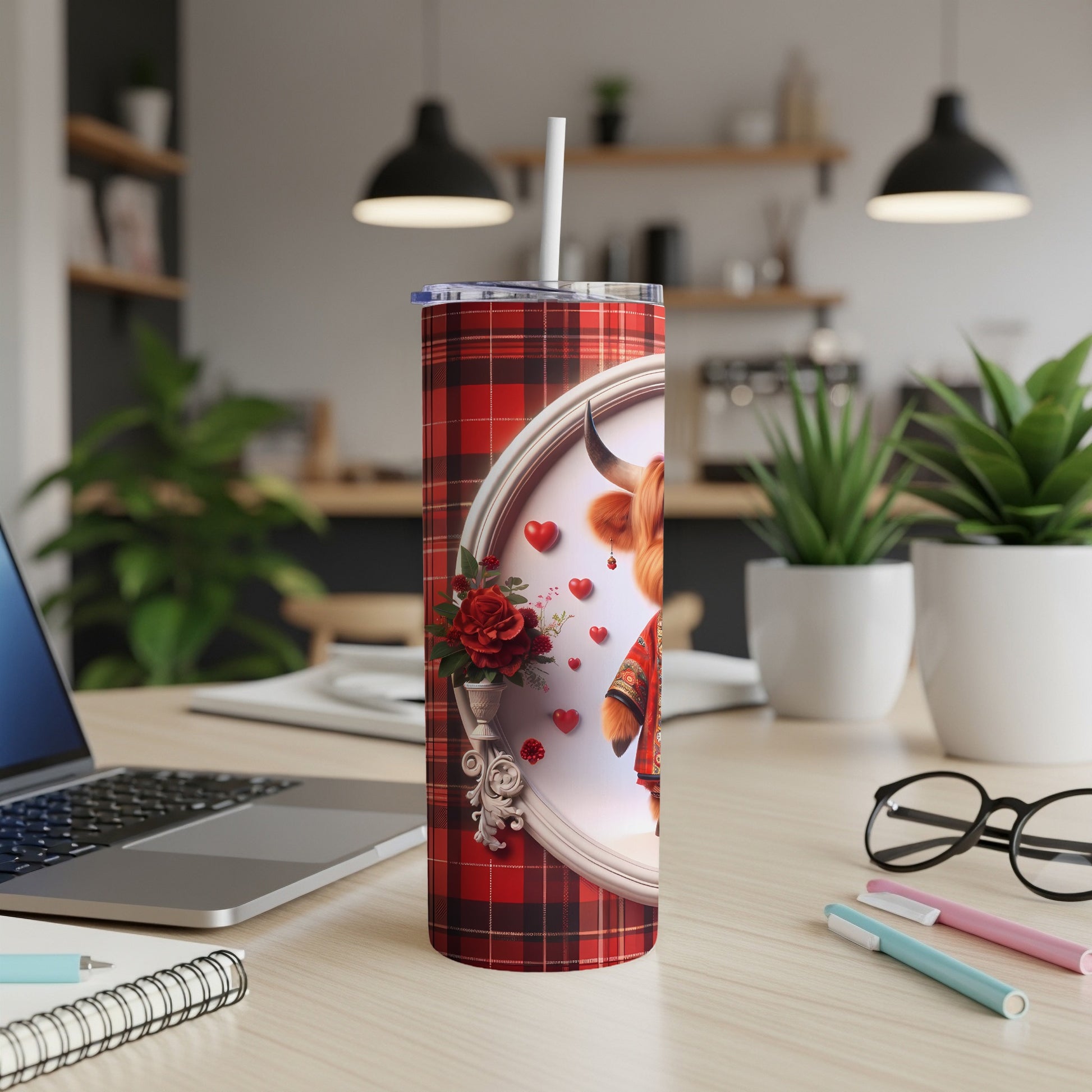 Red plaid tumbler with a highland cow illustration and floral accents.