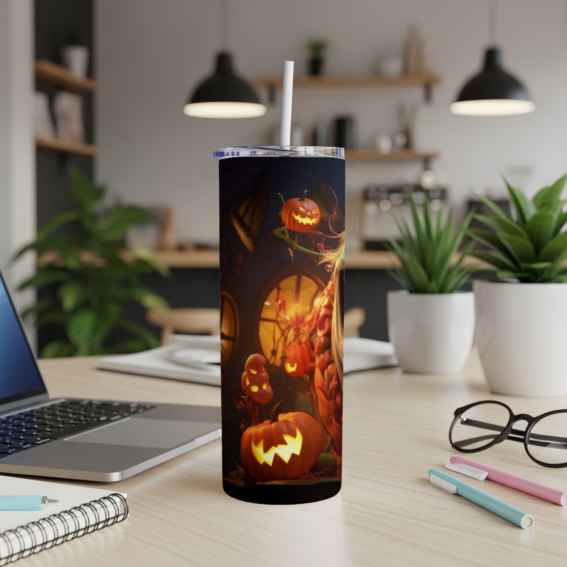 Tumbler with a Halloween design featuring jack-o'-lanterns and a spooky scene.