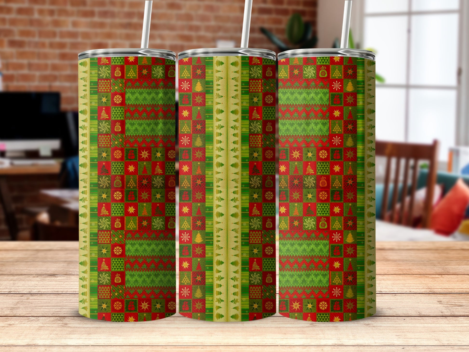 Three tumblers with a repeating green and red Christmas sweater pattern.