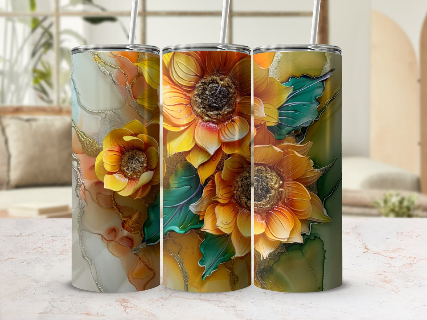 Three tumblers with vibrant sunflower and abstract marble designs.