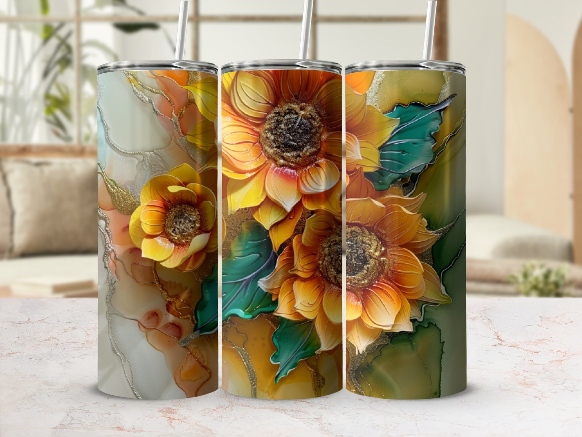 Three tumblers with vibrant sunflower and abstract marble designs.