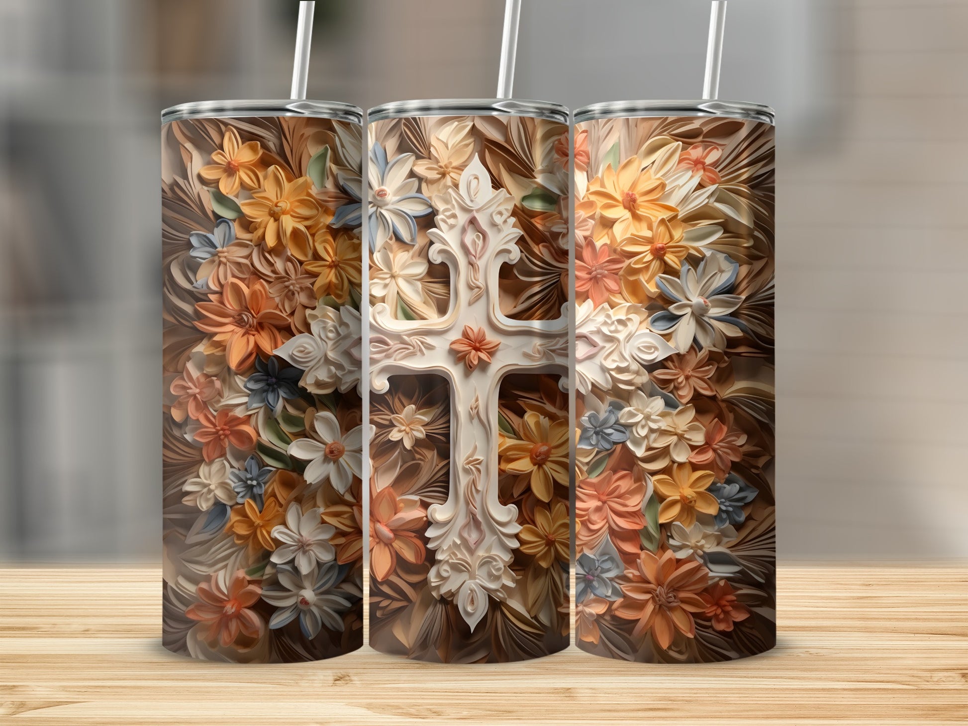 Three tumblers featuring a floral cross design.
