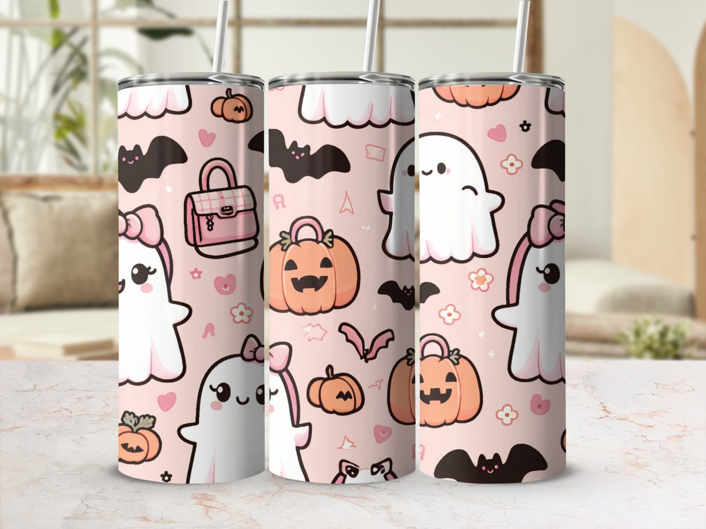 Pink tumbler with cartoon ghosts, pumpkins, bats, and bows.