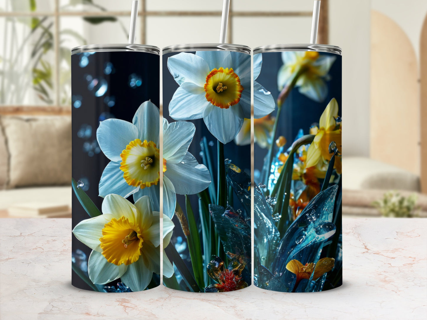 Three stainless steel tumblers featuring white and yellow daffodils with water droplets.