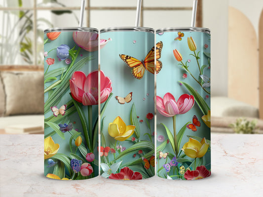 Three tumblers with a pink, yellow, and red floral and butterfly design.
