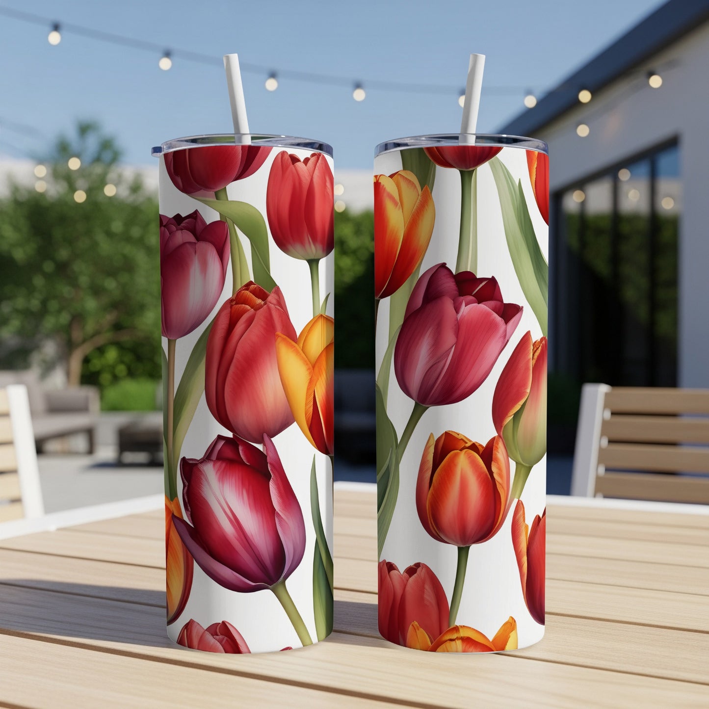 Two tumblers with a pattern of red and orange tulips on a white background.