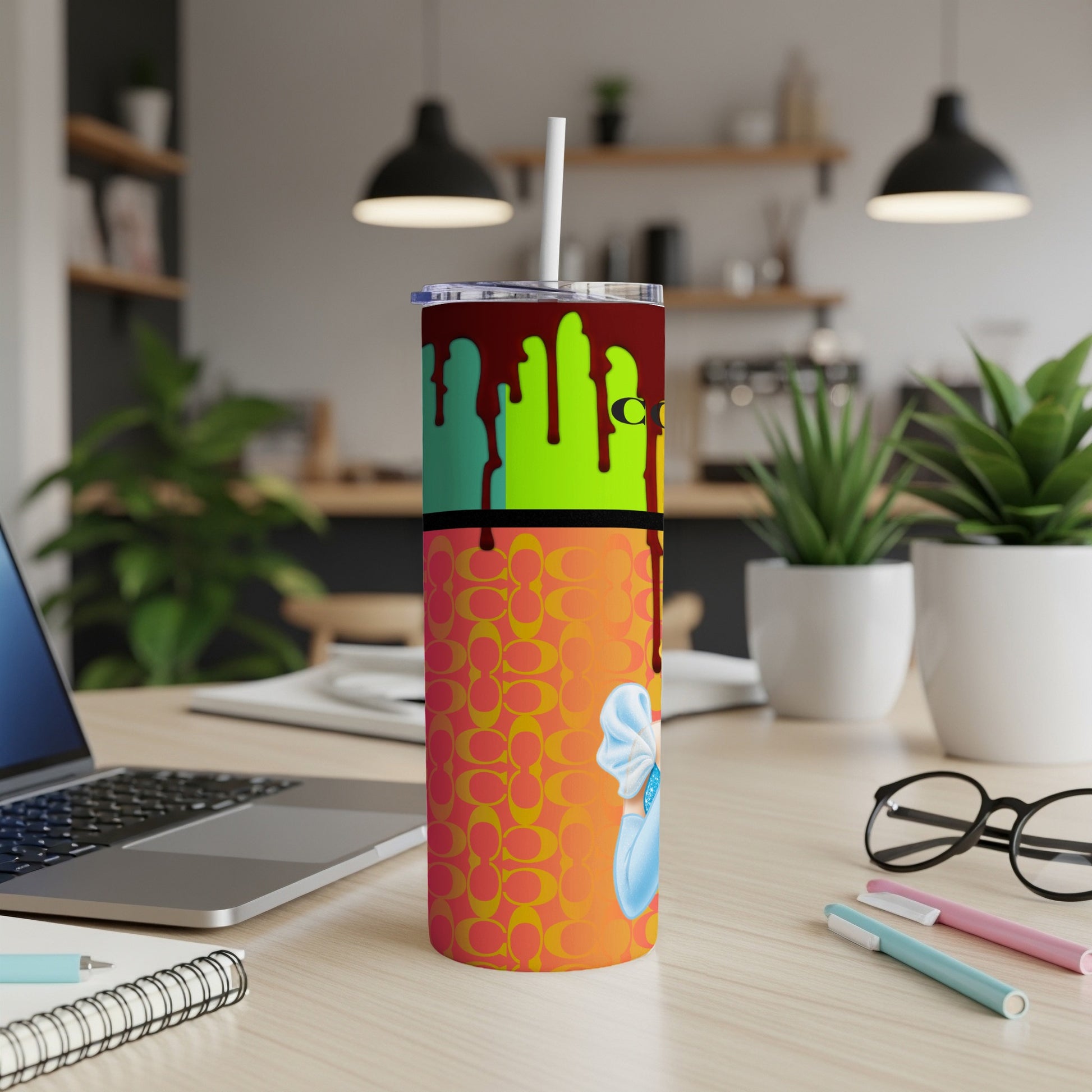 Tumbler with "C" pattern, dripping paint, and character.