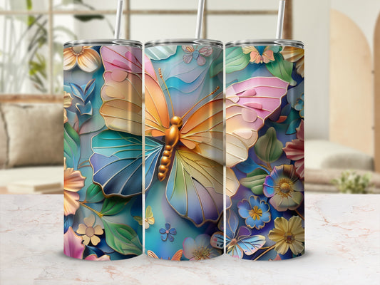 Butterfly and floral pattern on a skinny tumbler with straw.