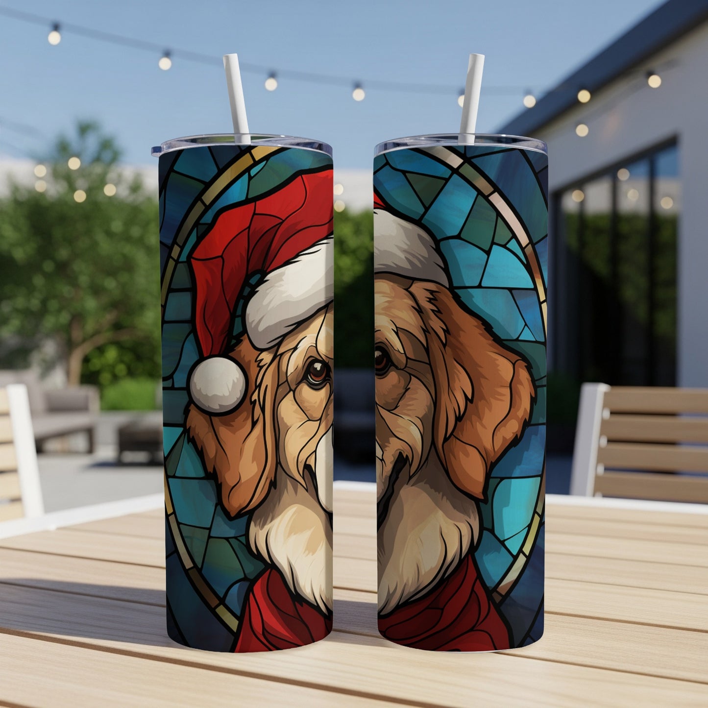 Golden retriever in Santa hat and scarf, stained glass style, on two tumblers.