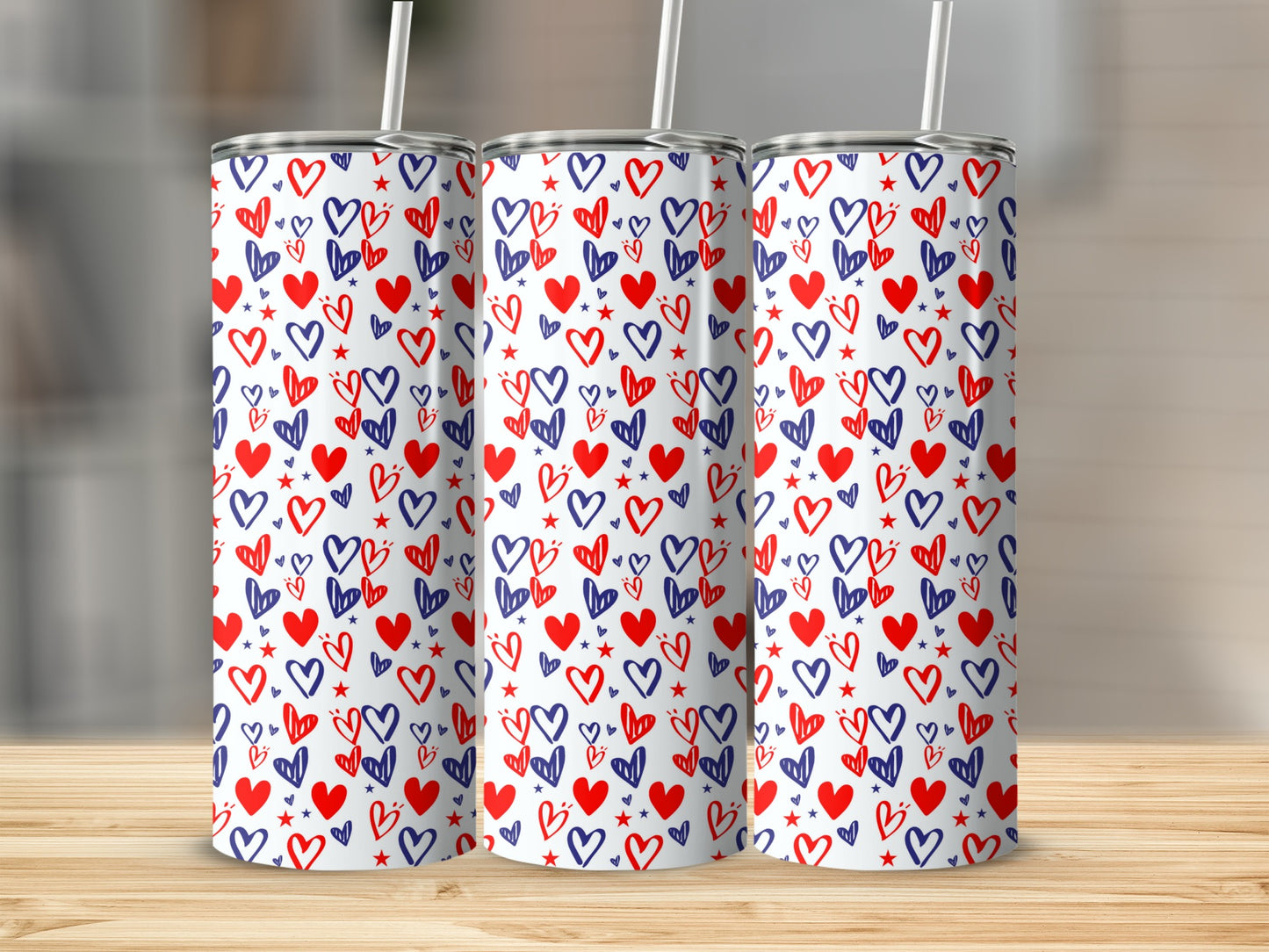 Three tumblers with a repeating red and blue heart pattern.
