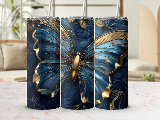Blue and gold butterfly tumbler with floral pattern.