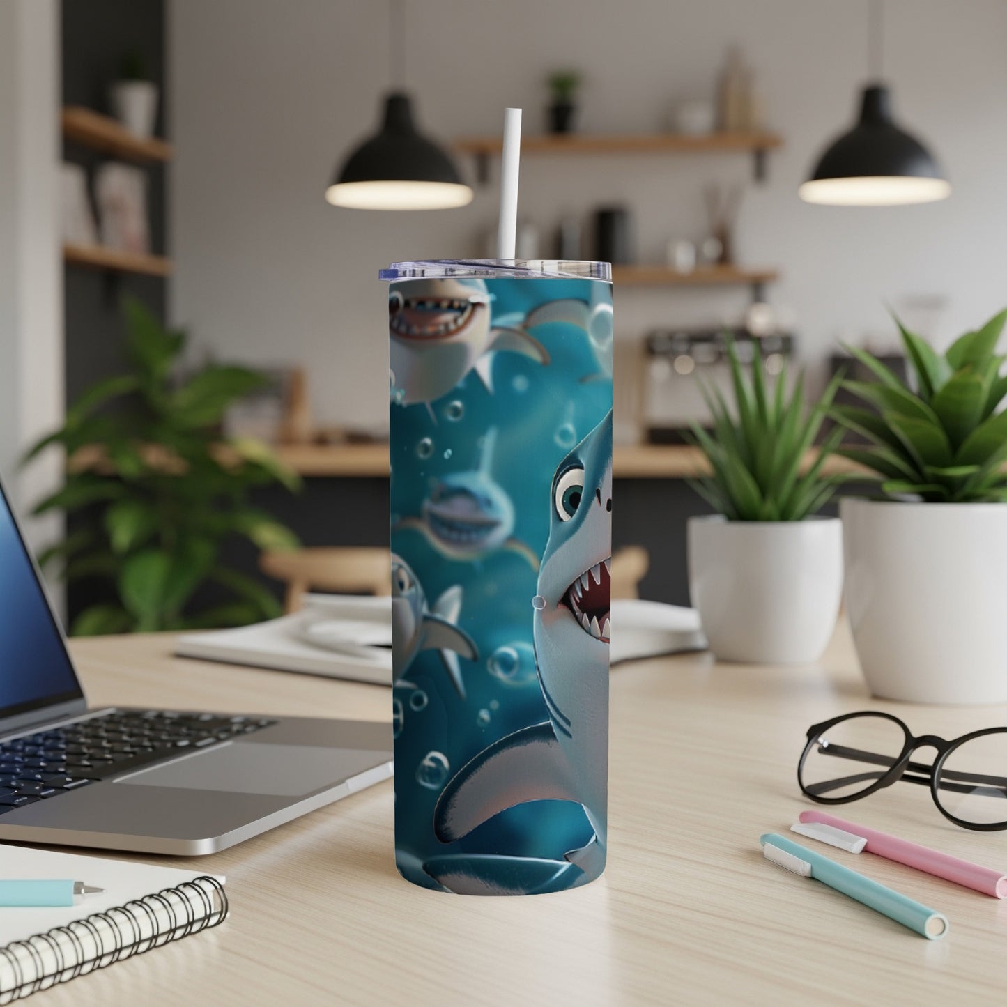 Cartoon shark with open mouth and straw on a tumbler, in a kitchen setting.