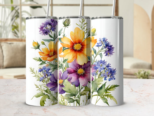 Three white tumblers with vibrant floral watercolor designs.
