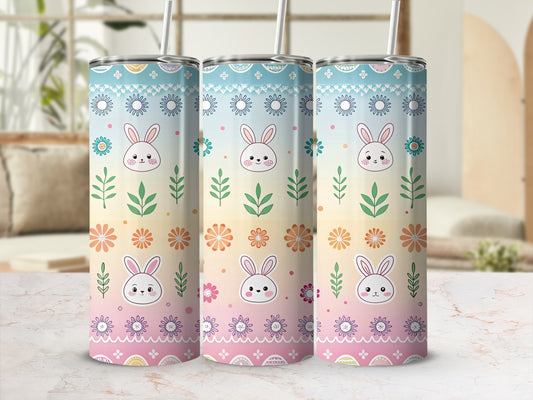 Three tumblers with a pastel bunny and floral pattern.