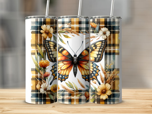 Three tumblers with butterfly and floral designs on a plaid background.