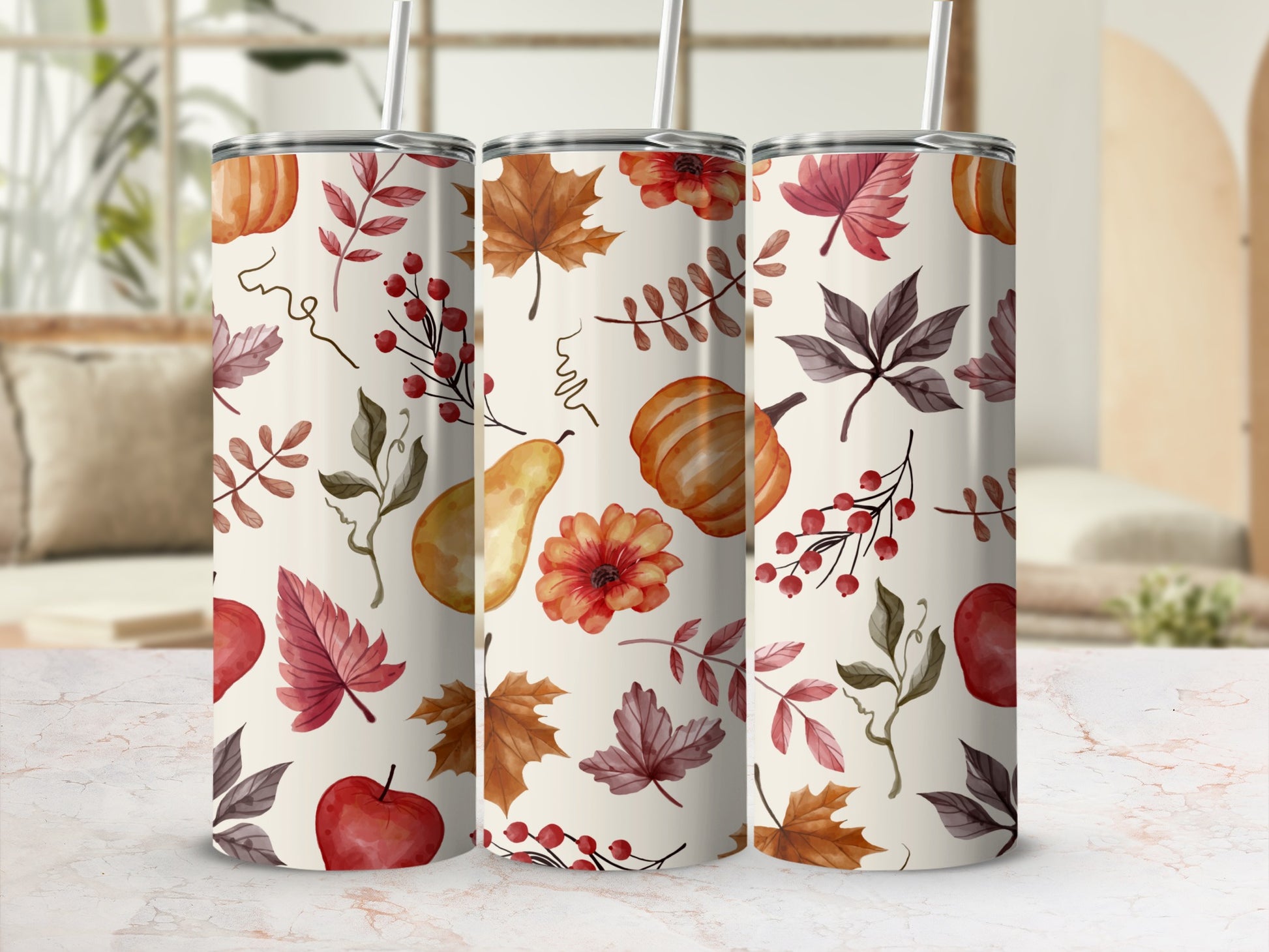 Autumn themed tumblers with pumpkins, leaves, and berries.