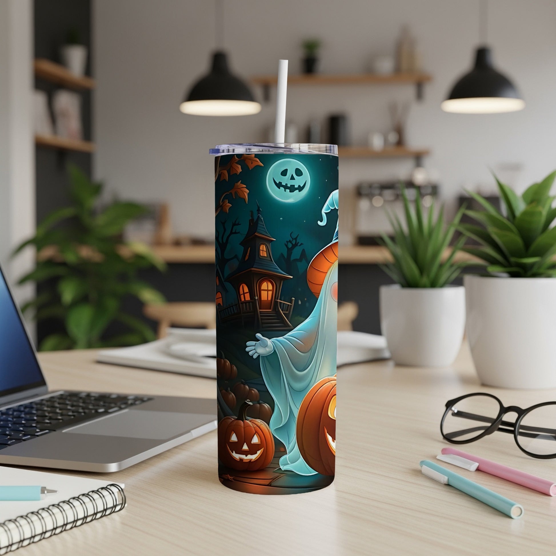 Halloween tumbler with ghost, pumpkins, and haunted house design.