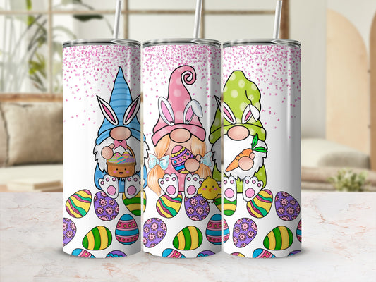 Three Easter gnomes in colorful outfits surrounded by decorated Easter eggs.