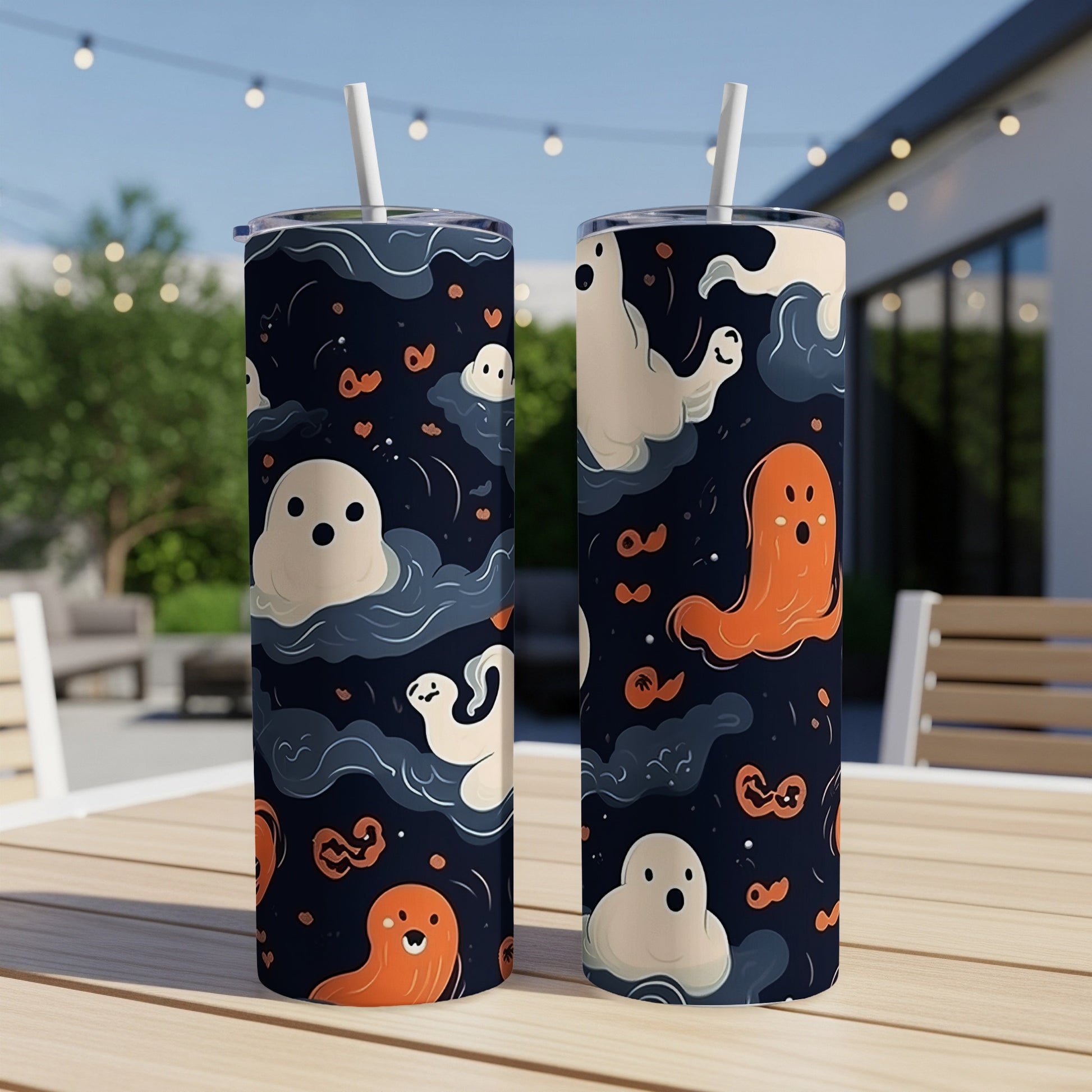 Two tumblers with a Halloween ghost pattern on a table.