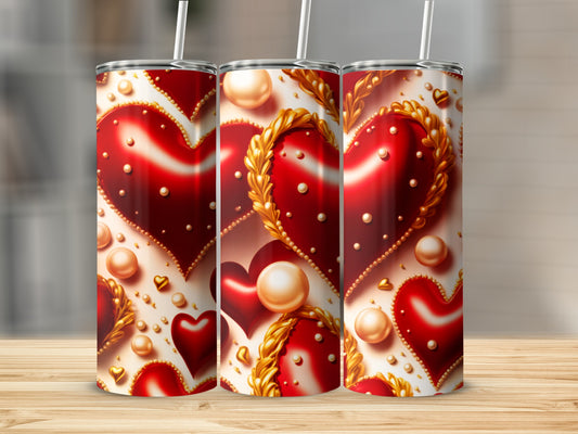 Three tall tumblers with repeating red heart and pearl designs.