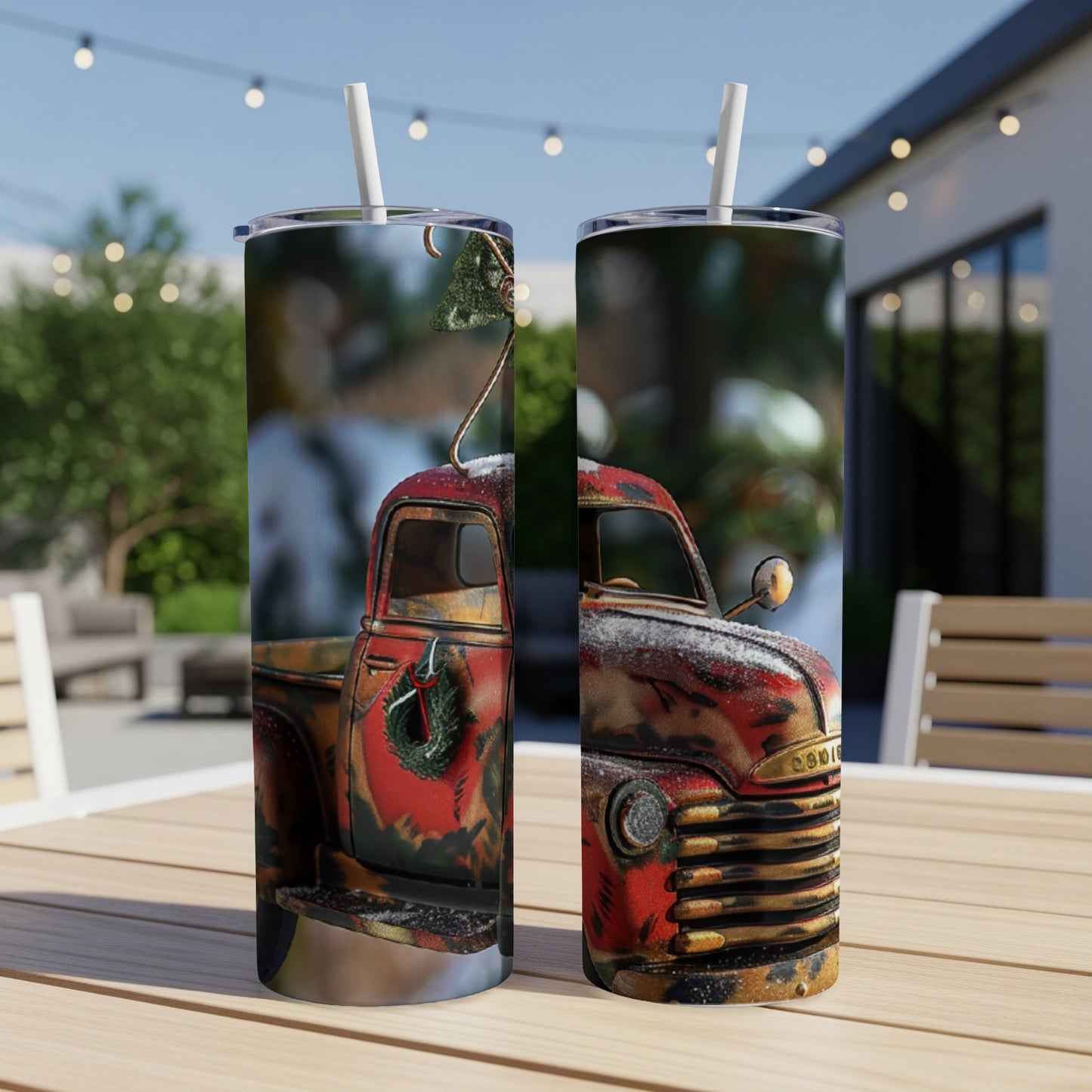 Two tumblers featuring a rustic red Christmas truck with a wreath and tree.