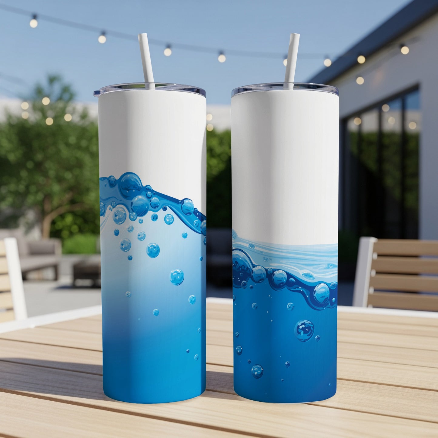 Two tall, slender tumblers with blue water and bubble designs.