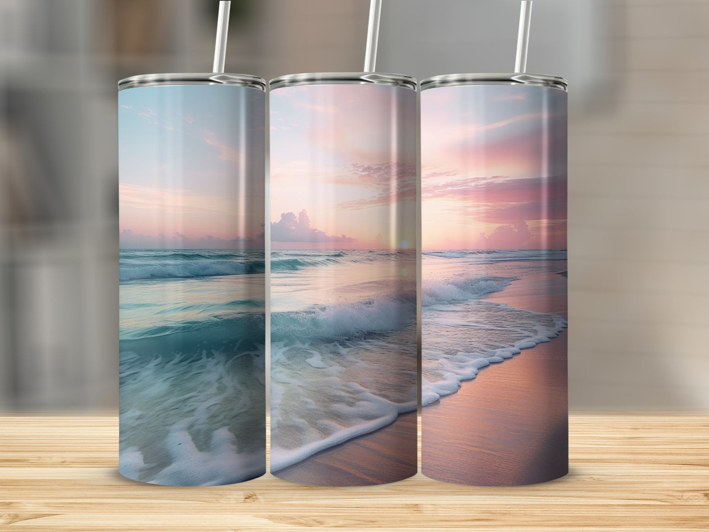 Three tumblers featuring a serene ocean sunset design.