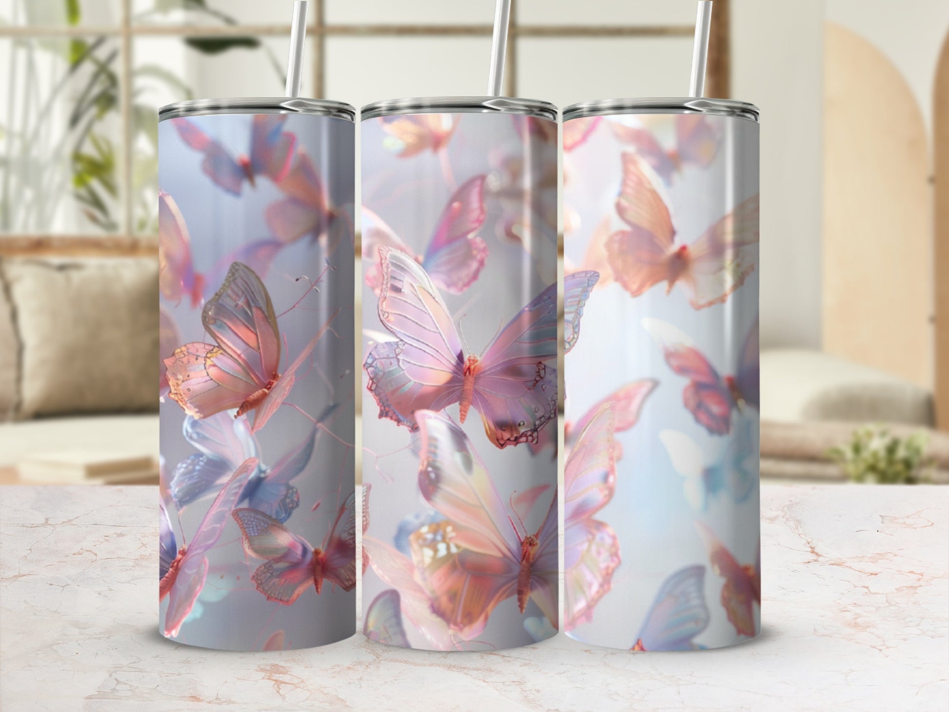 Three tumblers with pastel butterflies design, soft lighting.