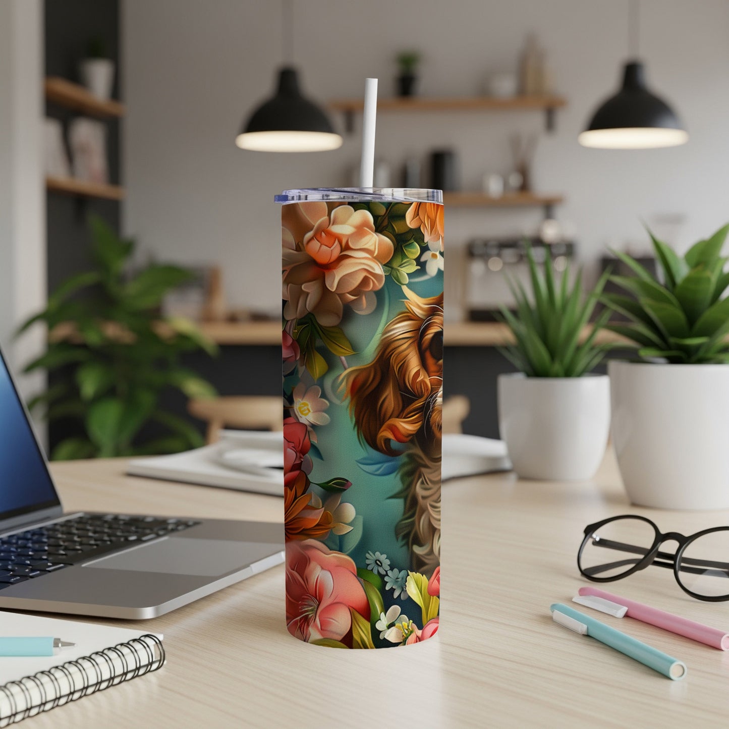 Dog face and floral pattern on a tumbler with a straw.