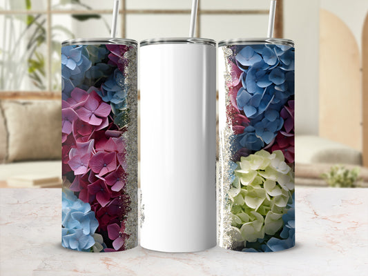 Blank white tumbler with floral pattern and glitter on a marble surface.