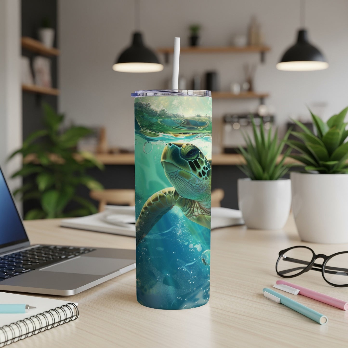 Sea turtle swimming underwater, depicted on a tumbler with a straw.