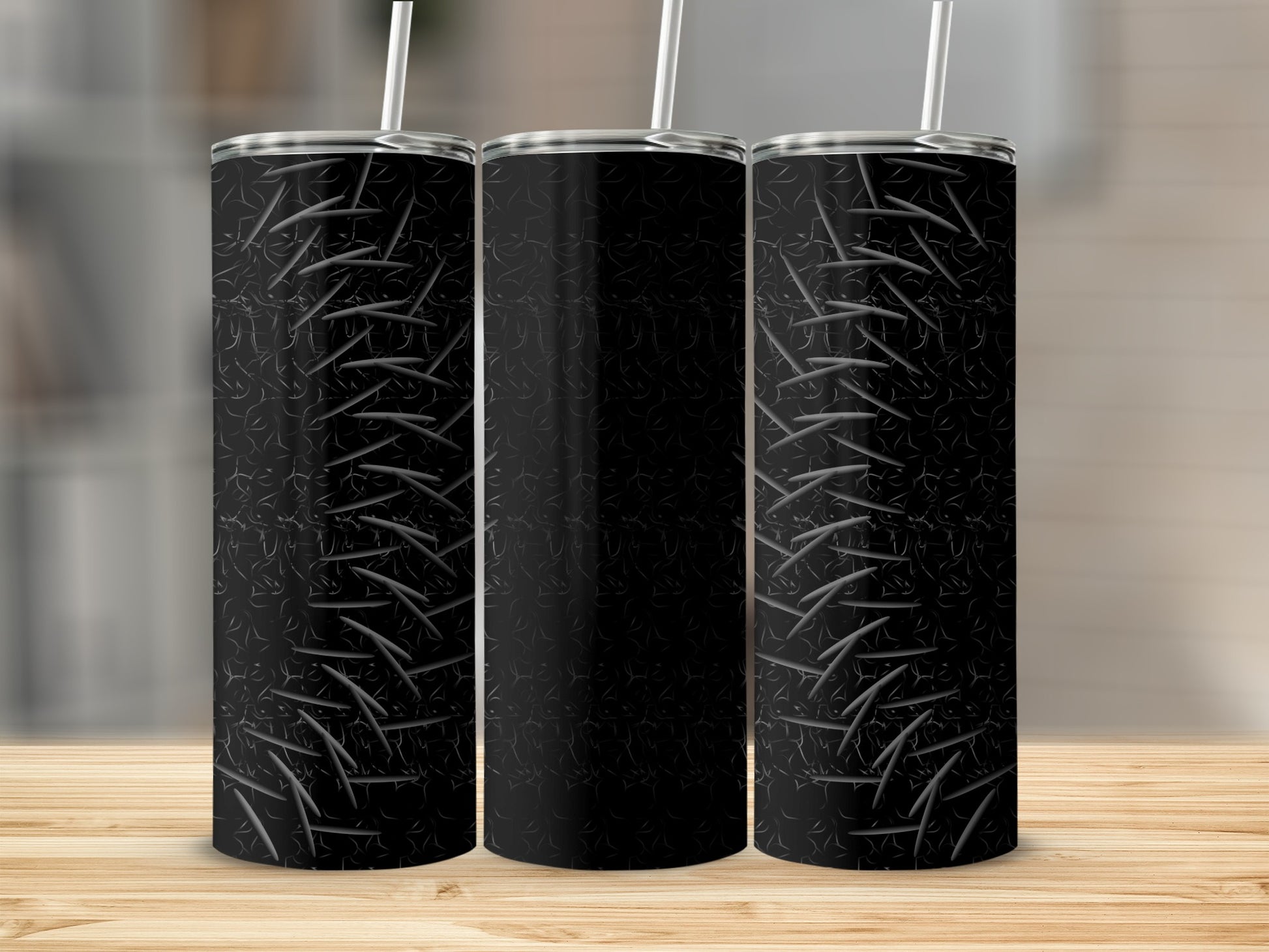Black tumbler with diamond plate texture and straw.