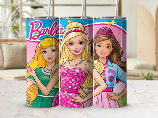 Three Barbie tumblers with colorful designs and straws in a display setting.