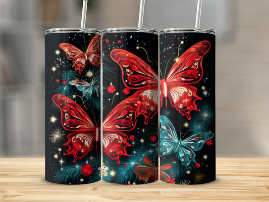 Three tumblers with red and blue butterflies and Christmas ornaments.