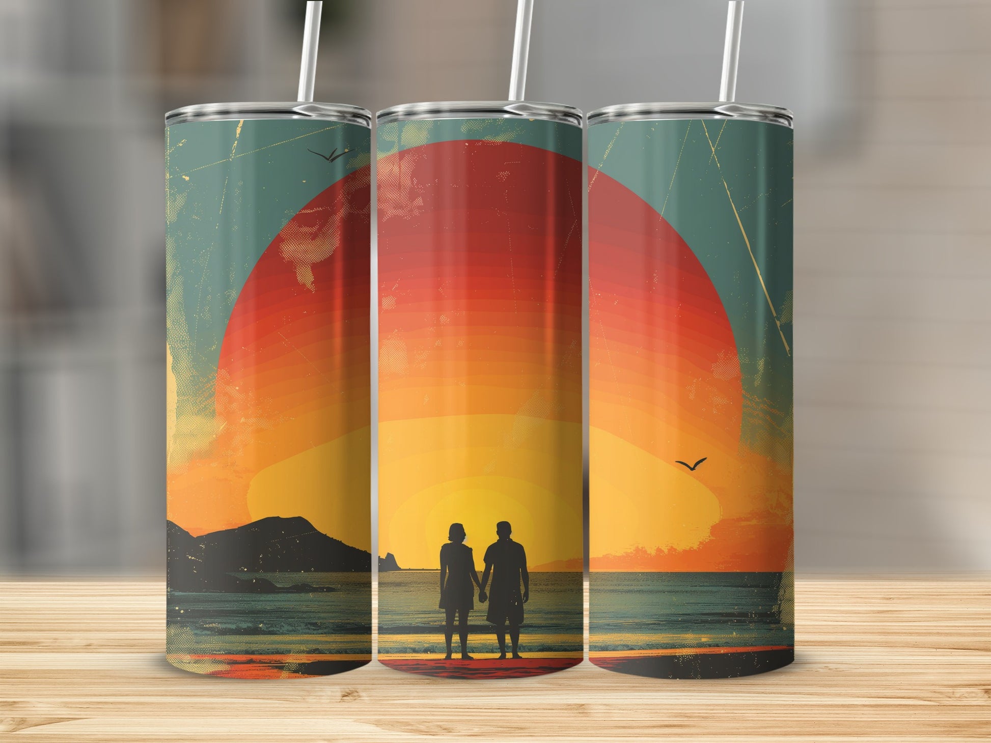 Couple holding hands on a beach with a large sunset behind them.